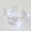 Миниатюра фото светодиодная гирлянда uniel роса белый uld-s1000-100/scb/3aa white ip20 dew ul-00007186 | 220svet.ru